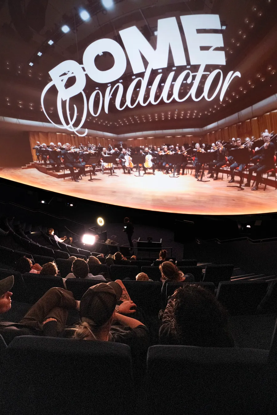 An audience under a fulldome projection